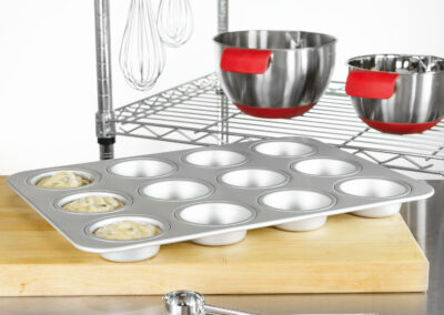 Standard muffin cupcake cake pan with a scoop in a bakery