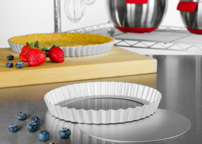 Tart & Quiche Pans with fruit tart in a bakery