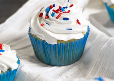 Blue Independence Day Cupcakes in a bakery.