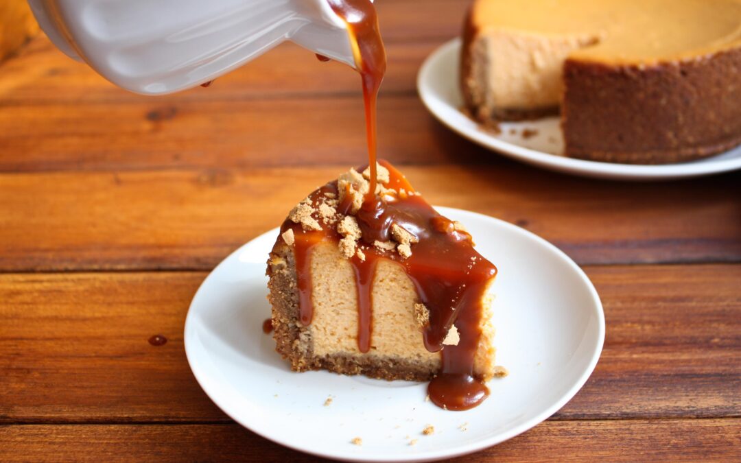 Cheesecake with turtle caramel sauce poured over it.