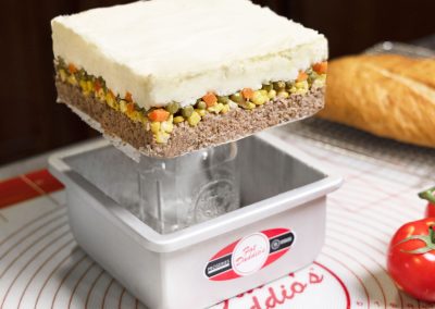 Shepherd's Pie in a Sheet Cheesecake Pan with removable bottom in a bakery