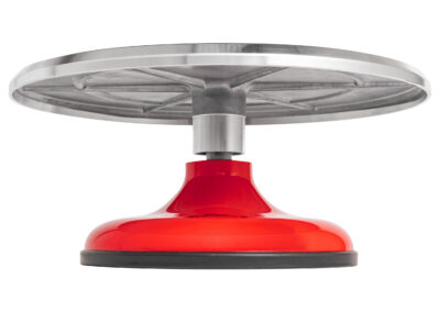 Cast aluminum revolving red cake stand profile view.